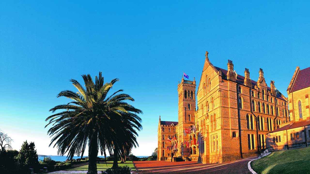 ICMS's main building illuminated in the light with a view of the ocean