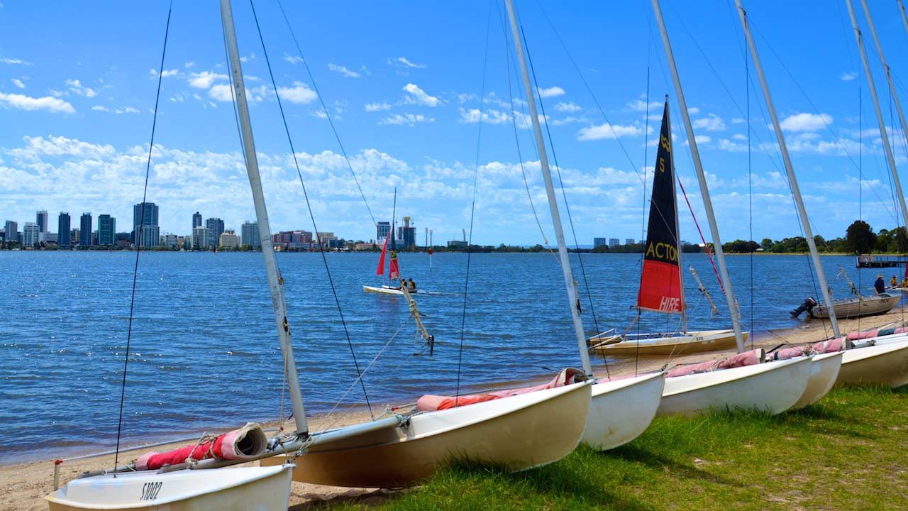 Sailboats docked along the shore in Perth, Australia