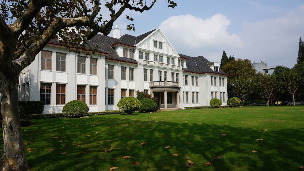 A large white house set on a green lawn in Shanghai