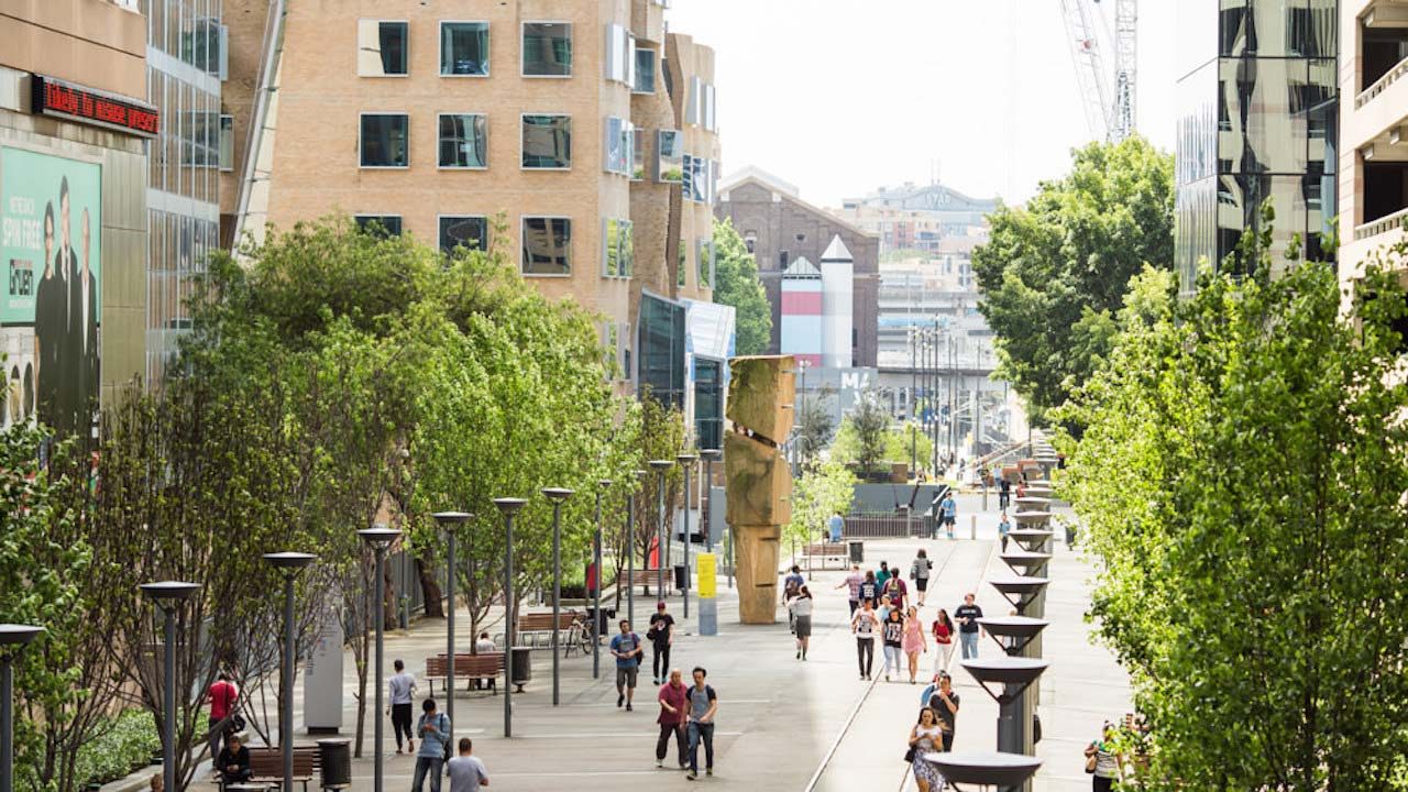 People walking along a main area of UTS's campus