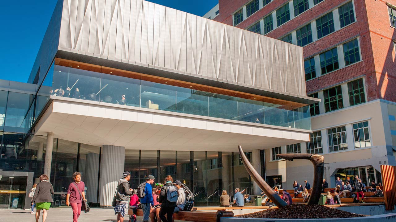 Students gather outside a building on VUW's campus