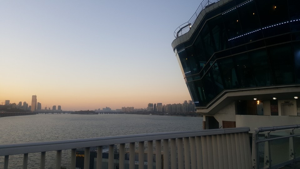 Dongjak Cloud Cafe at sunset with a view over the water 